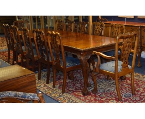 A large Chippendale style mahogany 16 piece dining room suite, comprising of breakfront sideboard, dining table and 14 chairs