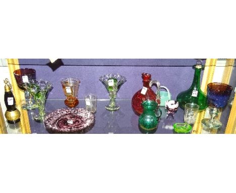 A collection of coloured glass items, to include ruby and emerald glass decanters, Murano green basket, pair of amethyst glas