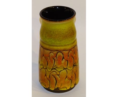 A Poole pottery vase, decorated with stylised yellow and orange glaze, stamped 'Poole England' to base, 23cm high