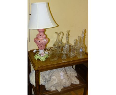 A Capo di Monte style ceramic table lamp with shade, 36cm high, together with some glass decanters, jugs and three large lace