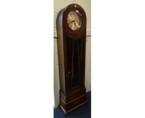 An oak cased longcase clock by Bravingtons Ltd Kings Cross & Ludgate Hill London Circa 1930's, the 8" silvered dial with Arab