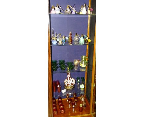 A quantity of coloured glass and perfume atomisers, to include cranberry glass table lamp, six cranberry glass tumblers, four