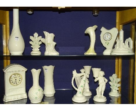 A quantity of modern Belleek porcelain, to include mantel clock, vases, figural posy vases, clover leaf decorated harp orname