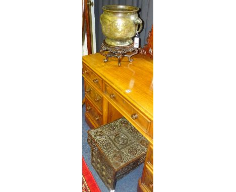 A Japanese bronze jardiniere, decorated with panels of birds and foliage, with twin elephant finials to either side, 22cm hig