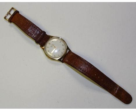 A Rotary Incabloc 9ct gold cased wristwatch, the white enamel dial with Arabic and baton numerals, on brown leather strap, st