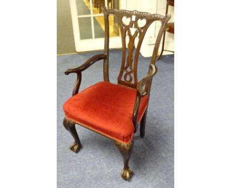 A Chippendale style carver armchair, with pierced splat back rest and velour covered stuffover seat, raised on cabriole ball 