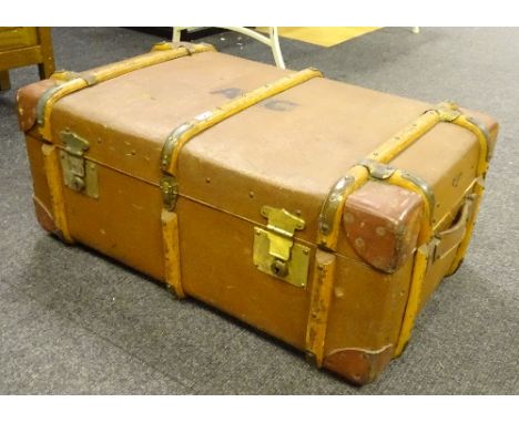 A vintage wooden bound travel trunk, with leather corners and handles, 34cm high x 79cm wide x 50cm deep