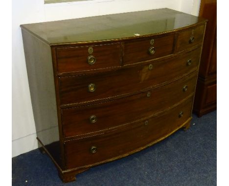 A Georgian mahogany bow front chest of drawers, with three small drawers above three long drawers, raised on bracket supports
