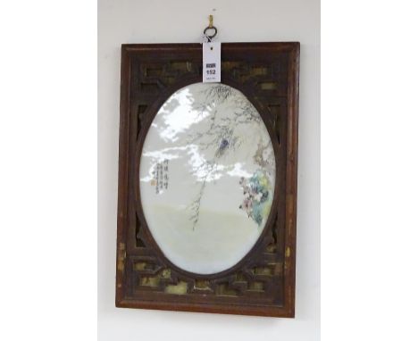 A Chinese famille rose ceramic panel, in pierced hardwood frame, decorated with locust in tree, signed with character marks, 