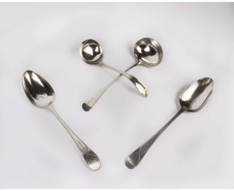 A pair of bright cut Georgian sterling silver soup spoons together with a Georgian silver ladle and one other ladle. 6.7ozt.