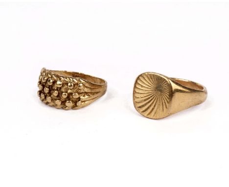 Two 9ct gold gentleman's rings, one with engine turned cartouche. 12g 