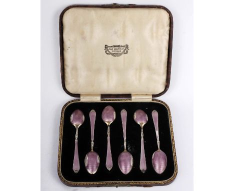 A boxed set of silver and enamel coffee spoons together with a boxed set of silver coffee spoons. 