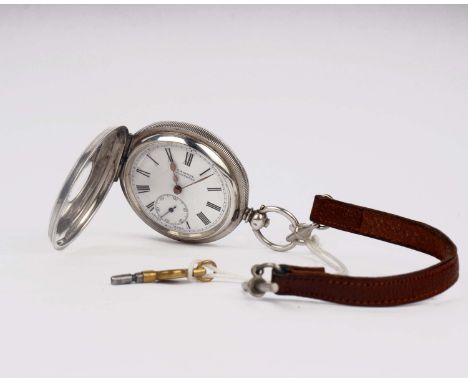 A sterling silver half hunter pocket watch by H. Samuel, Manchester, Engine turned case with key wind. 