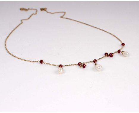 A 9ct gold pearl and ruby necklace. 2.5g