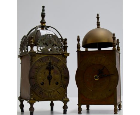 AN OLD FRENCH BRASS CASED STRIKING MANTLE CLOCK, TOGETHER WITH A SIMILAR REPRODUCTION EXAMPLE     