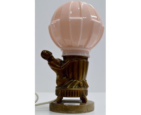 AN ART DECO COLD PAINTED FIGURINE TABLE LAMP ON MARBLE STAND WITH A PINK GLASS SHADE     