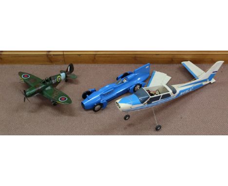 An unboxed 'Schylling' die cast model 'Bluebird' Sir Malcolm Campbell, 52cm long plus a tin plate model Spitfire and a part m