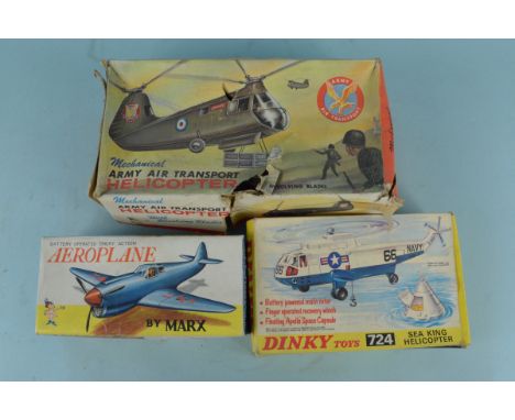 A Dinky 724 Sea King Helicopter and Capsule together with a Louis Marx Army helicopter