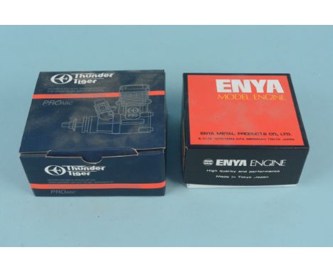 A boxed Thunder Tiger Pro-46 model engine plus an Enya 41-4C engine, both appear unused