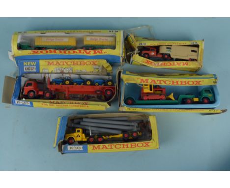Five boxed Matchbox K Series vehicles including Low Loader, Dodge Tractor Train with Twin Tipper