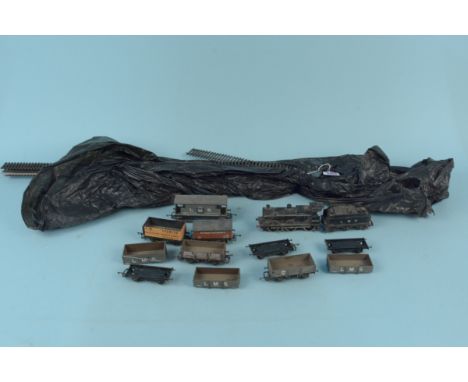 An Airfix engine with tenders plus a selection of track