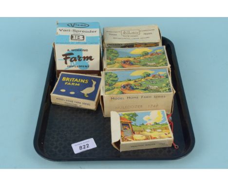 Six vintage boxed Britains farm accessories including 9538 vari spreader, 130F two wheel tipping trailer, 175F cultivator, 17