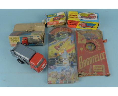 A vintage Thunderbirds and a Dan Dare bagatelle board (part box) and three boxed vehicles in playworn boxes