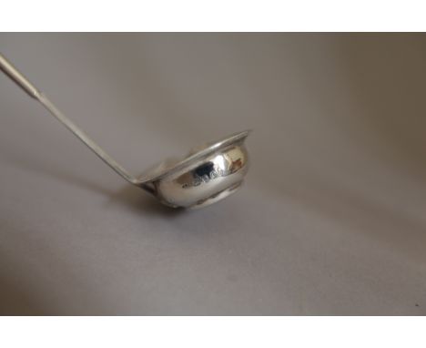 A GEORGE III PUNCH LADLE with a mounted twisted whalebone handle and a reeded border, around the bowl, maker's mark "JS", Lon