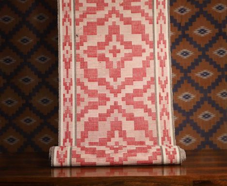 A cotton runner, c.1950s, Swedish, Stockholm, on a red ground, 580 x 58cmCondition ReportThere are some very small marks and 