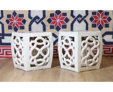 A pair Chinese pottery garden seats, 20th century, of scrolled design, in a white glaze36cm square47cm high (2)Condition Repo