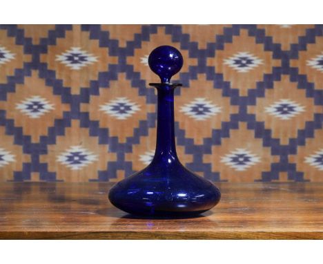 A blue glass ship's decanter, c.1830, with globe stopper and flat bottom18cm diameter28cm high 