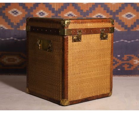 A woven bamboo trunk, 20th century, leather bound with brass fixings and handle,46cm square56cm highCondition ReportThere are