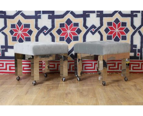 A pair of polished metal stools, of recent manufacture, in the manner of Paul Evans, upholstered in grey velvet,48cm square48