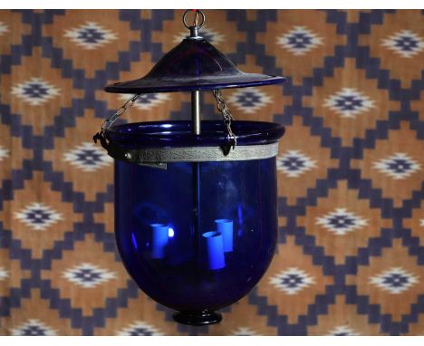 A blue glass mosque lantern, c.1900, with three light fitting,23cm diameter47cm high