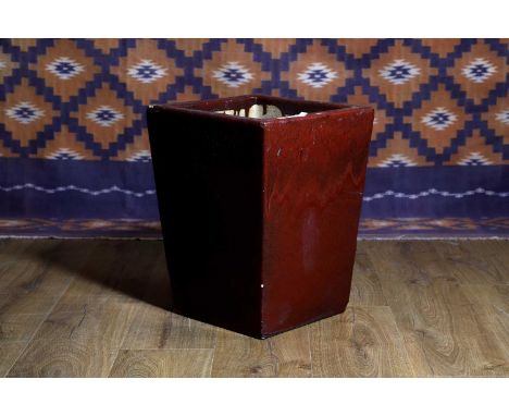A Chinese stoneware planter, of recent manufacture, in an oxblood red glaze,35cm square46cm hightogether with another Chinese
