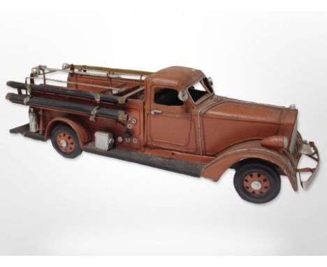 A tin plate model of a vintage fire engine, length 52 cm 