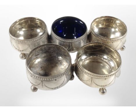 A group of five silver salts, one with blue-glass liner, together with a small silver napkin ring. CONDITION REPORT: 236.5g g