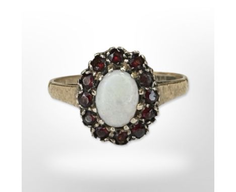 A 9ct yellow gold opal and garnet cluster ring, size O CONDITION REPORT: 2.2g.