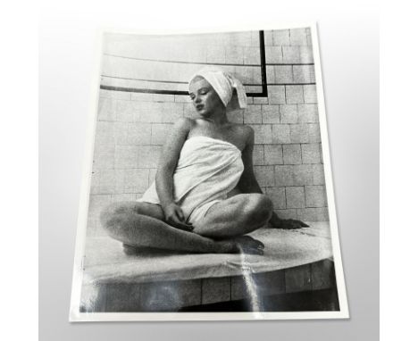 A monochrome photograph depicting Marilyn Monroe in the sauna at the Bel Air Hotel.