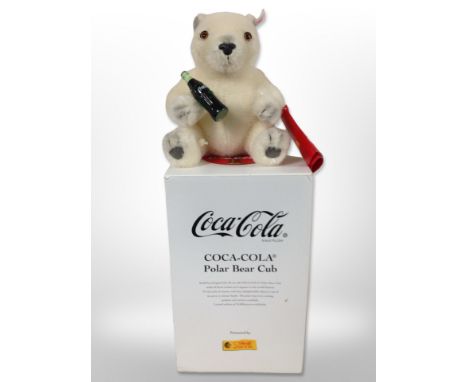 A Coca-Cola polar bear cub bear, manufactured by Steiff, in box, limited edition of 10,000 pieces.