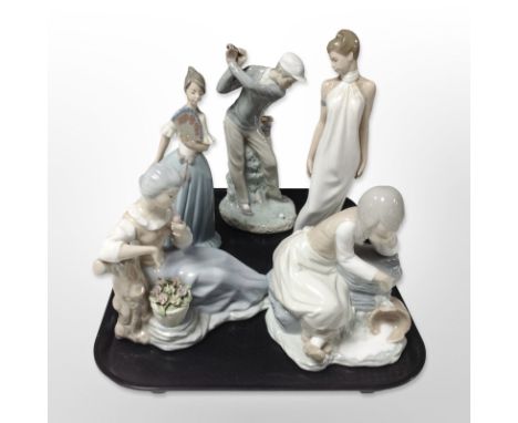 A Lladró figure of a golfer and three Nao figures of ladies and a further Spanish figure of a lady.