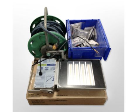 A hose pipe on reel, box containing socket fittings, Loxa light in box.