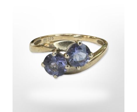 A 9ct yellow gold two stone amethyst ring, size O/P CONDITION REPORT: 2g.