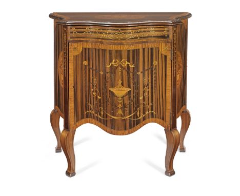 A late Victorian zebrawood, satinwood, purplewood and marquetry serpentine commodeCirca 1900, inlaid with Neoclassical urns, 