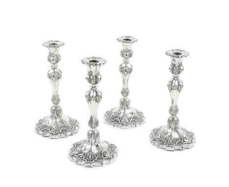 A set of four Victorian silver candlesticksJohn Waterhouse, Edward Hatfield &amp; Co, London 1847 Neo-Gothic style, with remo