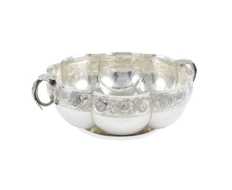 A large Mexican silver bowlprobably 19th century Lobed form, with two handles, diameter 34.5cm, weight 75oz.For further infor