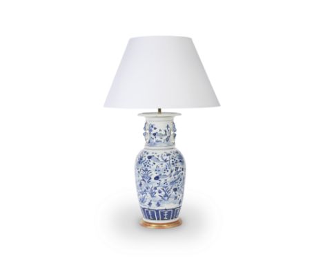 A large 19th century Chinese blue and white porcelain vase adapted as a table lamp with shadethe baluster body painted in the