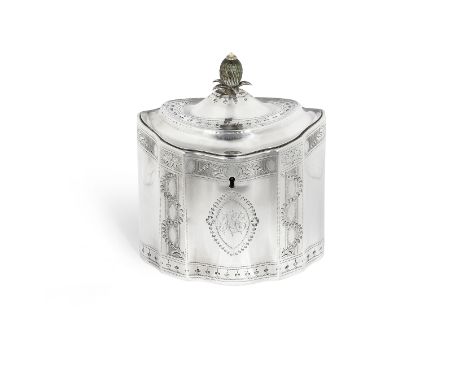 A George III silver tea caddyJohn Denziloe, London 1791 Cusped oval form, with a stained green ivory pineapple finial, with b