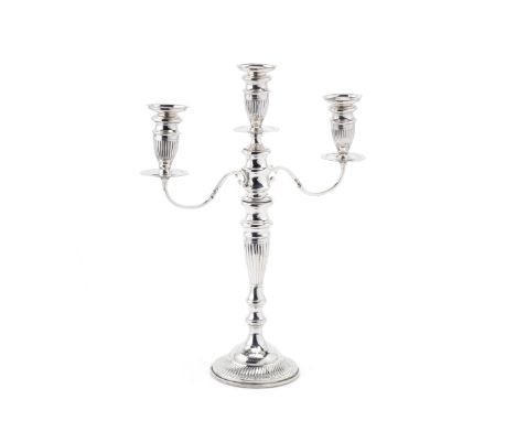 A silver three-light candelabrumSigmund Zyto, London 1922 With gadroon decoration and removable drip-pans, nozzles and sconce