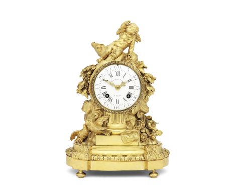 A good late 18th century ormolu mantel clocksigned Noel Baltazarthe drum-case surmounted with a winged putto on a reeded colu